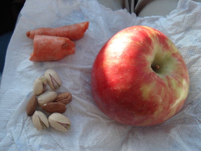 Giant apple with carrots and some nuts