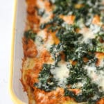 pumpkin, goat cheese and kale lasagna in a yellow casserole dish