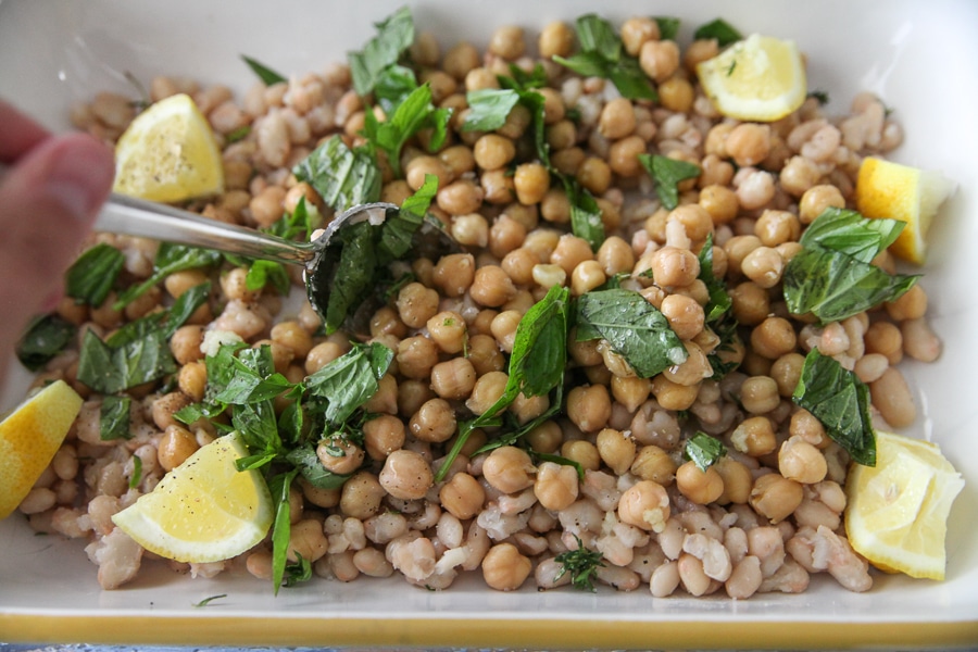 stirring beans and herbs