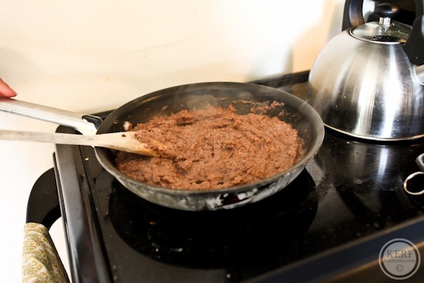 pureed black beans cooking for Salvadoran Breakfast