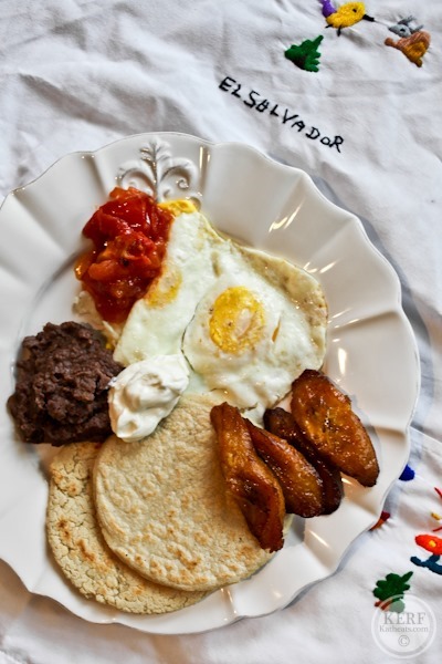 Salvadoran Breakfast plate of food with eggs, tortillas and plantains