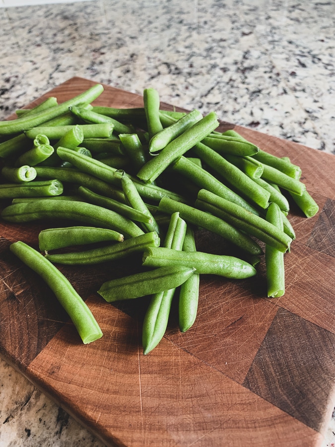 cut green beans on a cutting board