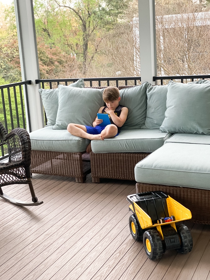 boy reading kindle kids edition on sofa