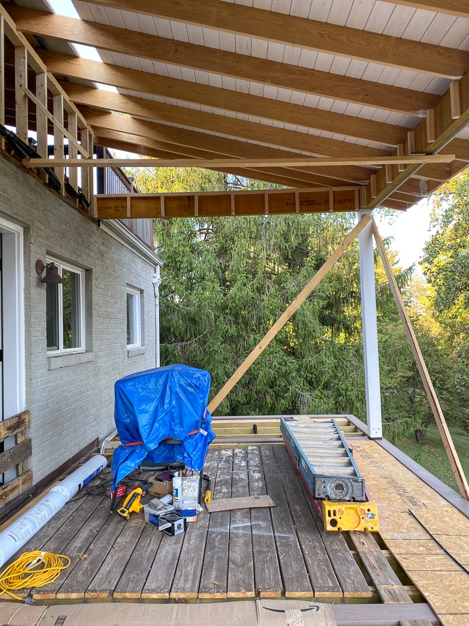 porch under construction with partial roof