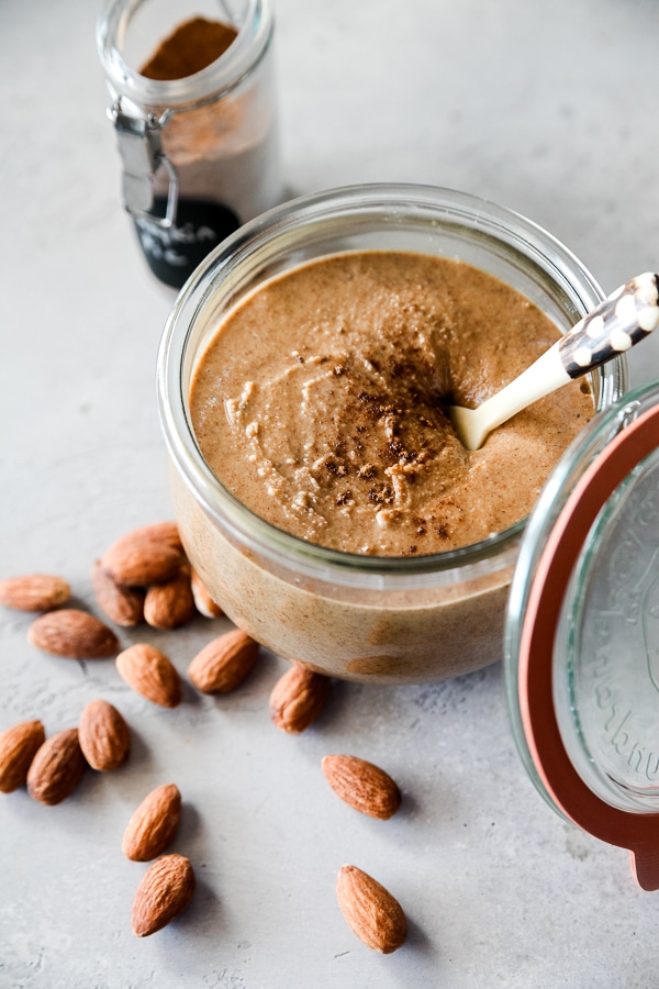 pumpkin spice almond butter in a weck jar with almonds and pumpkin spice
