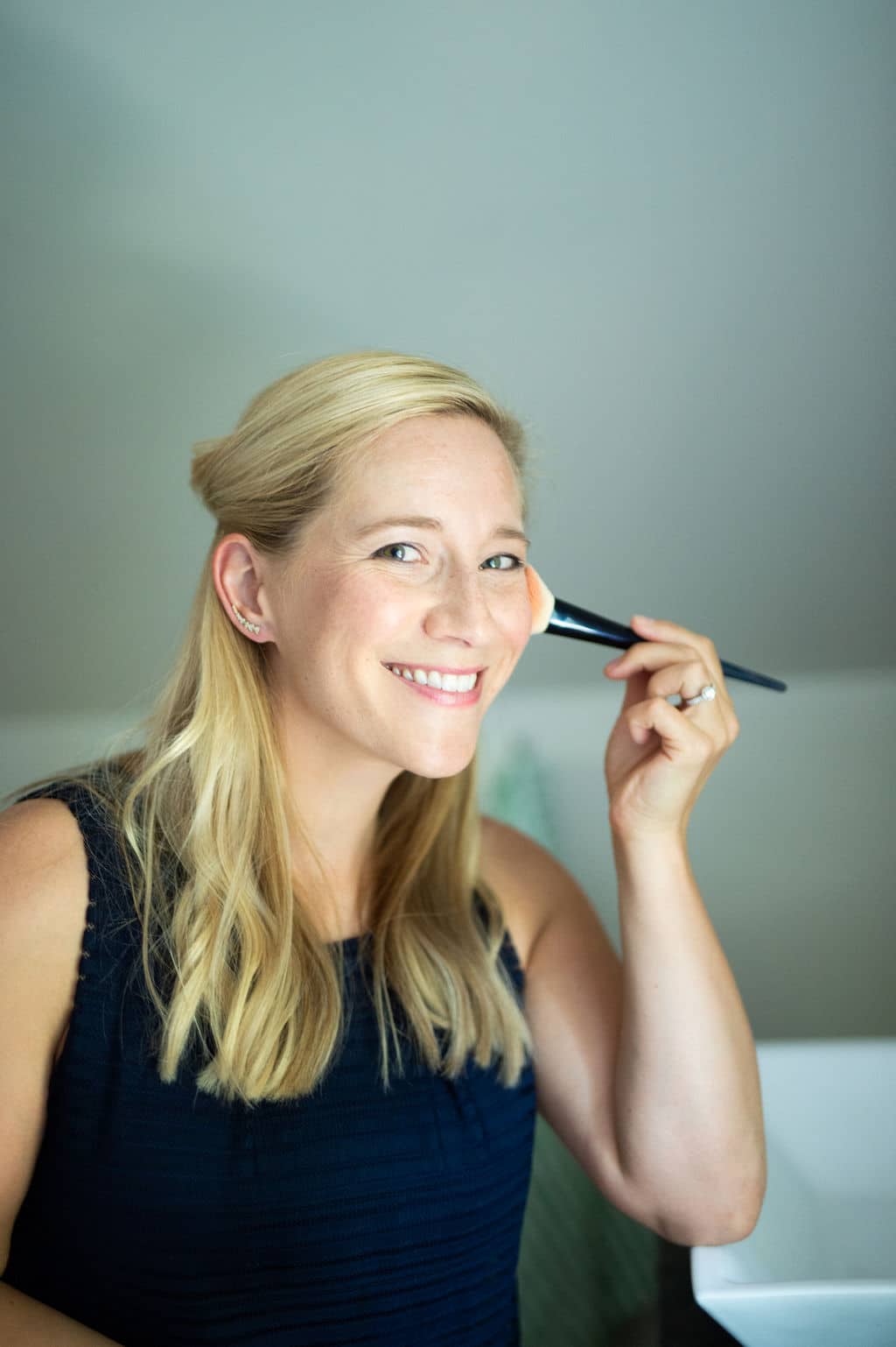 Kath Younger applying blush. 