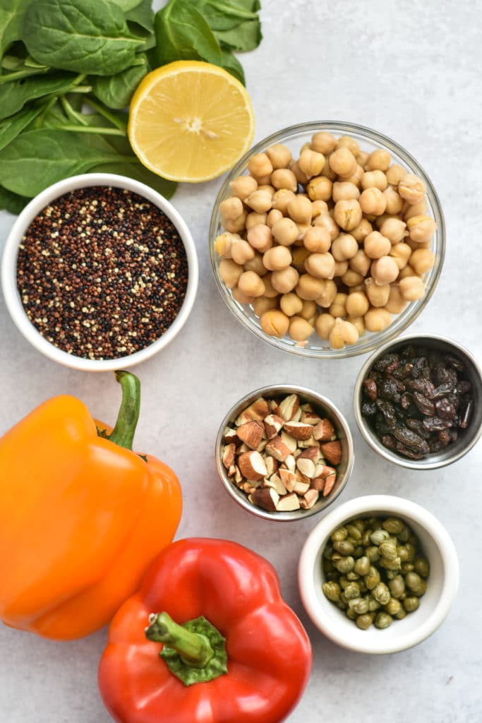 moroccan salad ingredients in bowls with peppers