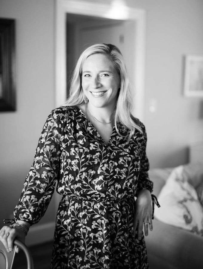 kath standing in a dress in black and white