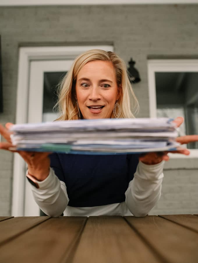 crazy eyes over a stack of paper