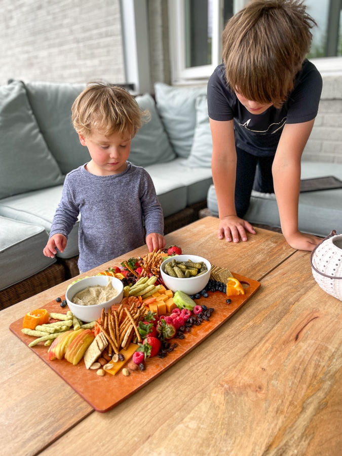 two boys enjoying Kids Charcuterie Board 