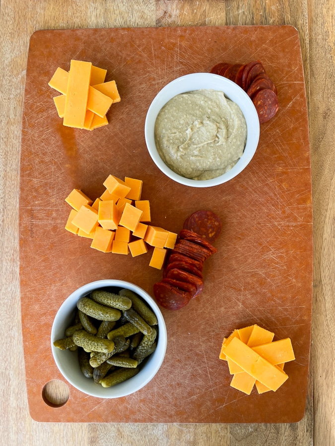 Kids Charcuterie Board with bowls, cheese, and pepperoni