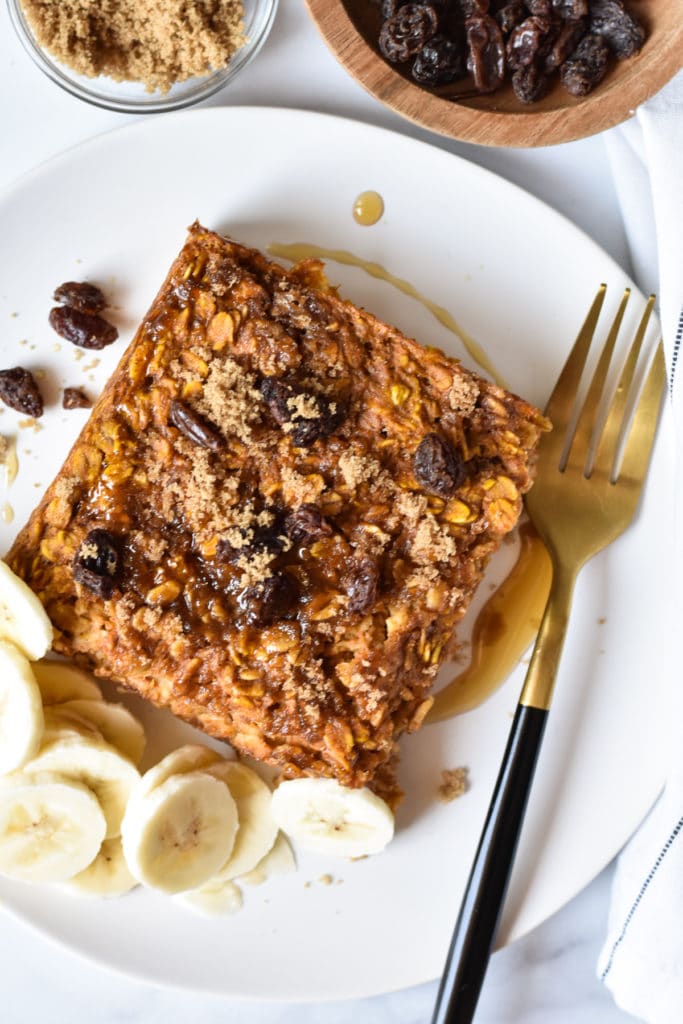 one square of healthy baked pumpkin oatmeal and bananas on a plate with a fork
