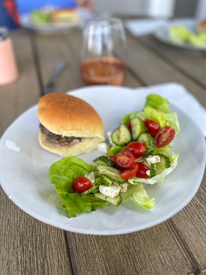 burger and salad on white plate
