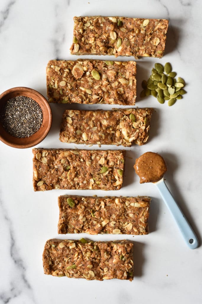 Easy Energy Bar Recipe with dish of chia seeds and spoon of almond butter