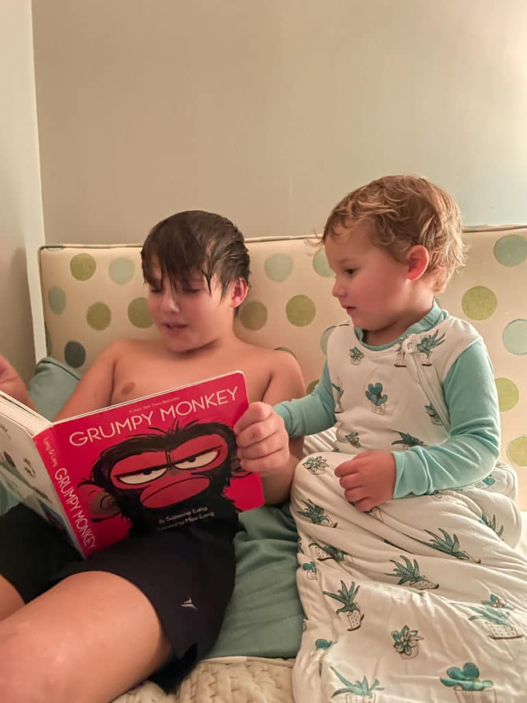 brother reading a book - Whats New in Food + Life