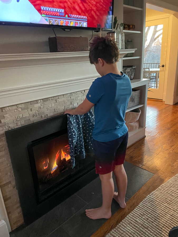 Mazen warming up by the fire | Day In The Life