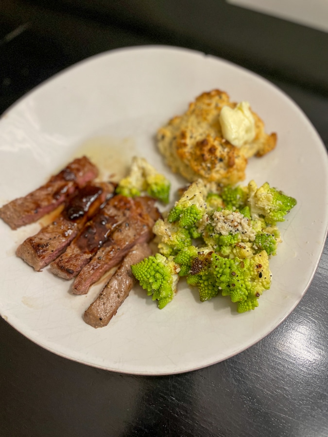 Flank steak with cauliflower with everything bagel biscuits