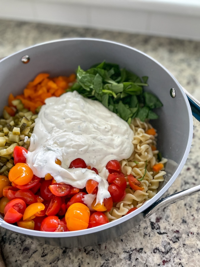 Pour dressing over pasta salad