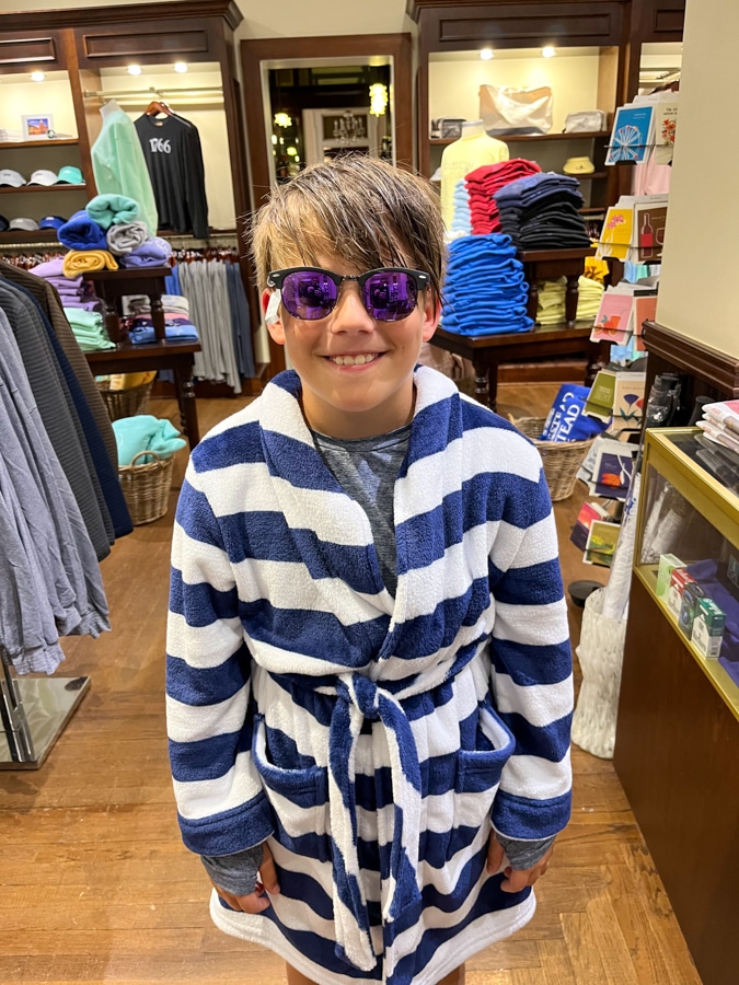 little boy in striped robe and shades
