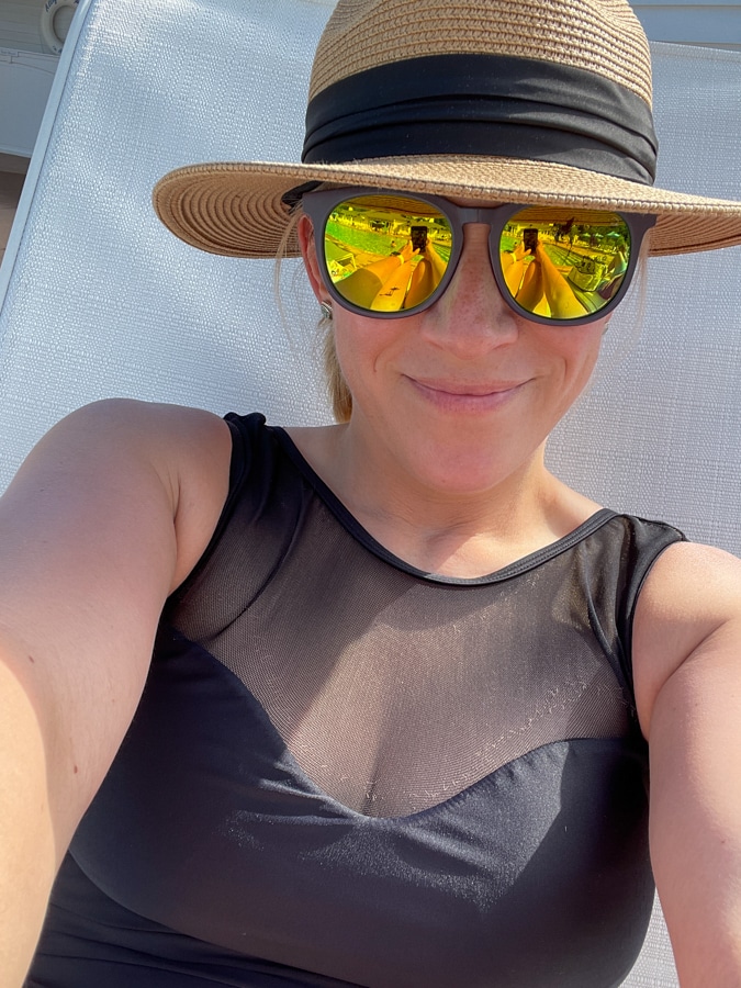 woman in straw hat and swimsuit