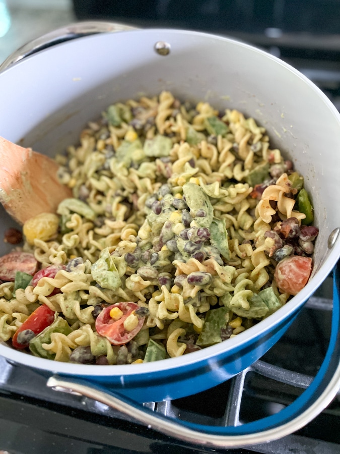 Pour dressing and tomatoes into pot