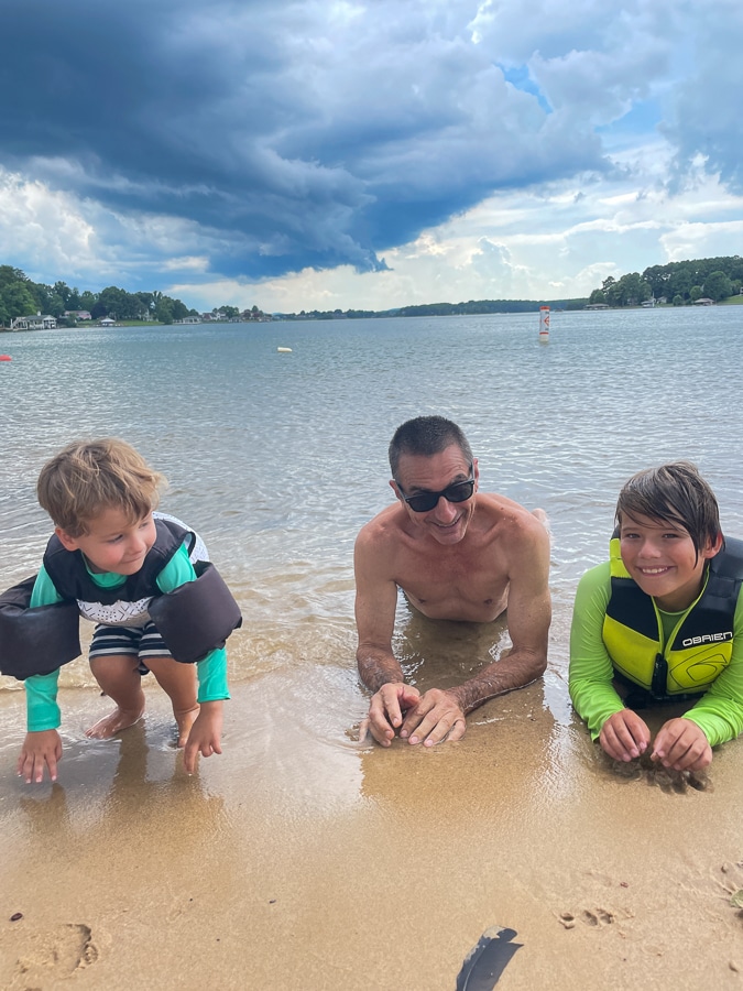 grandpa and grandkids in the sand