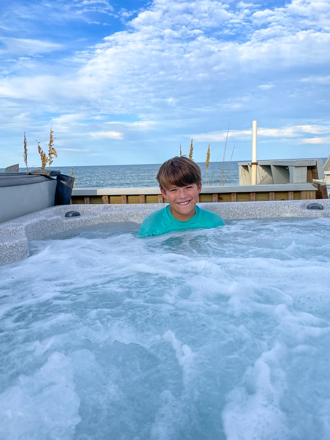 boy soaking in hot tub