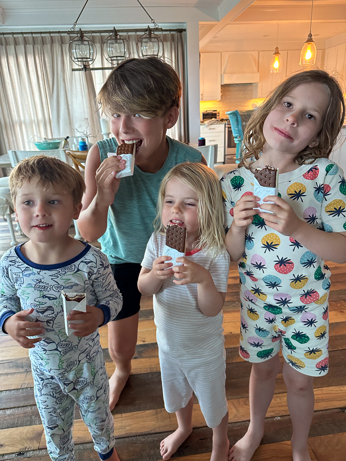 cousins eating ice cream sandwich