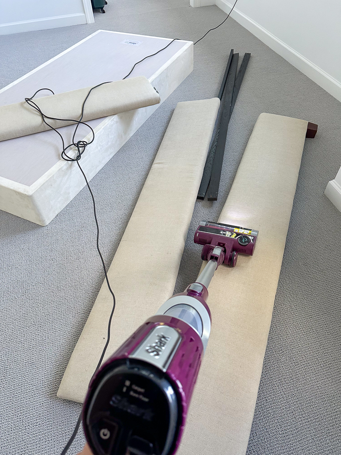vacuuming fabric in bed