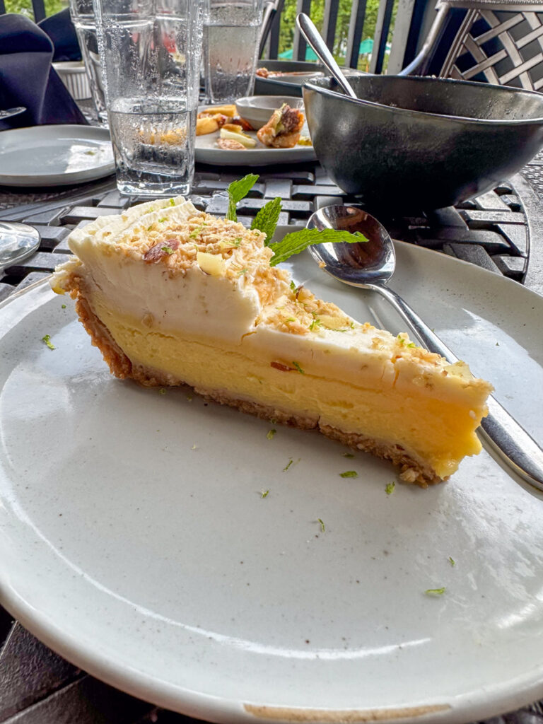 Kath Eats Blogger Kath Younger shares their Bear Lake Reserve vacation: in photo: a plate with a slice of cheesecake 