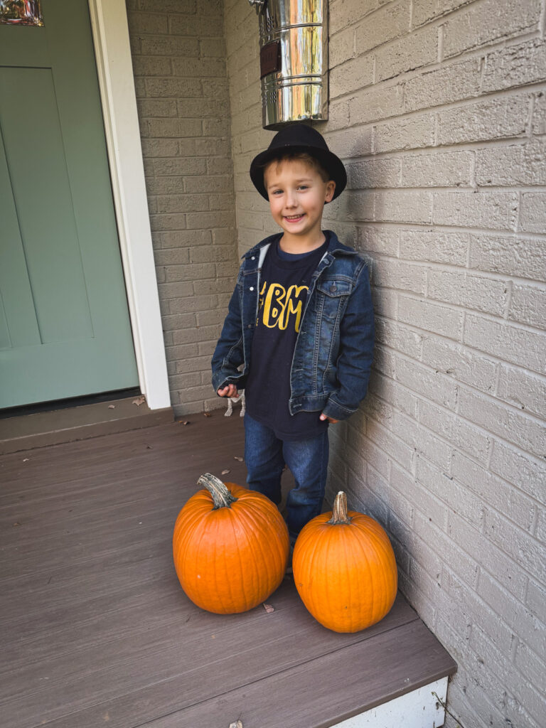 Kath Eats Blogger Kath Younger shares her Birthday week with a photo of his son standing near two pumpkins