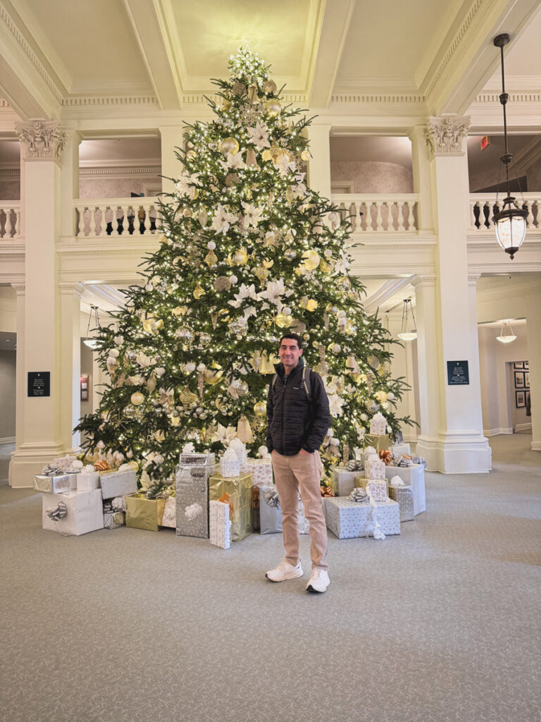 Kath EatsBlogger Kath Younger shares Homestead Holiday - photo of a man near the Christmas tree