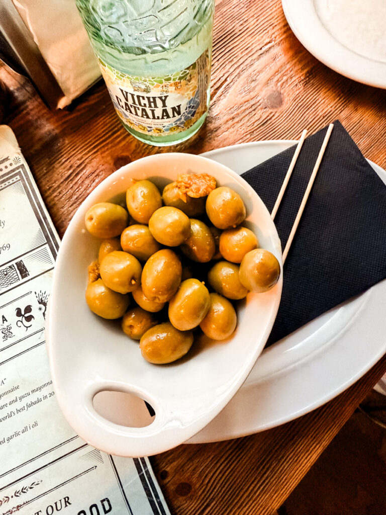 sparkling water and olives